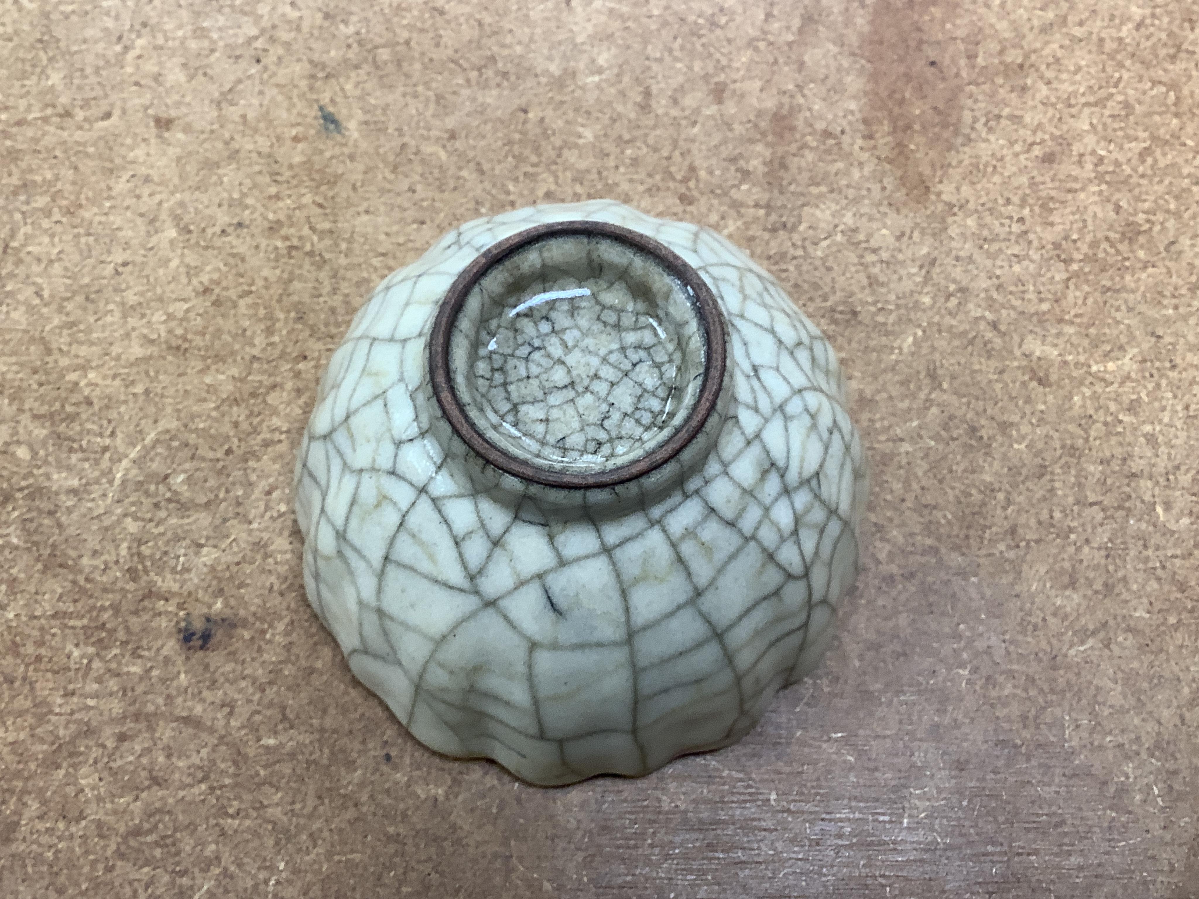 A collection of Chinese porcelain and pottery to include a naturalistic teapot, crackle glaze bowl and a ‘dragon’ bowl, largest 10cm in diameter